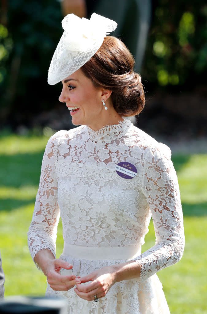<p>For the Royal Ascot in 2017, Kate looked demure in a long-sleeved white lace dress. </p>