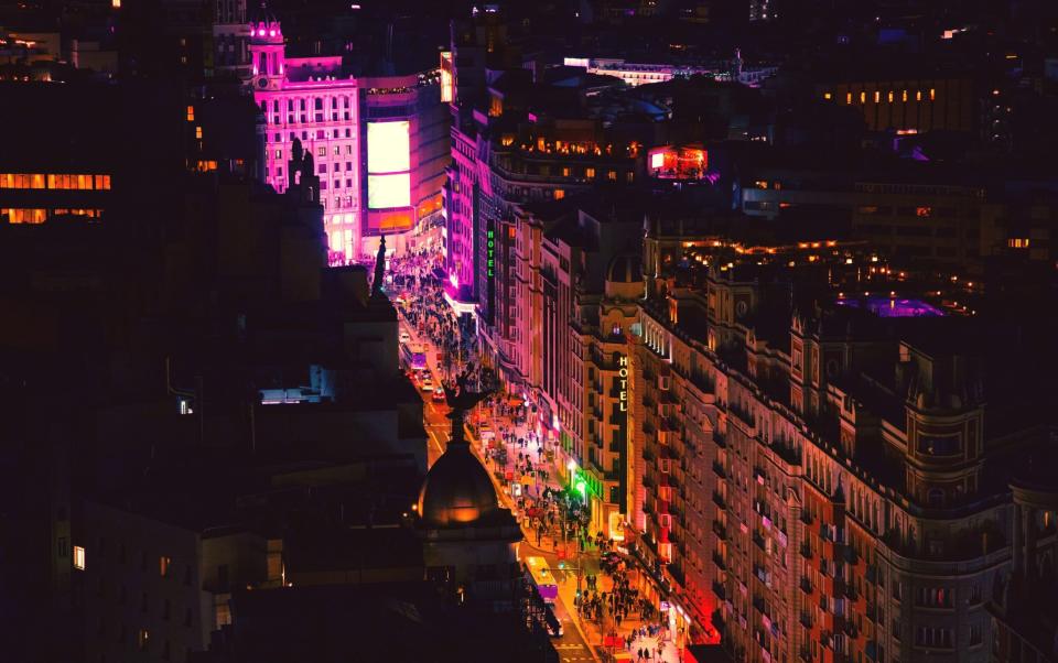 Madrid's crowded and bustling Gran Via at night