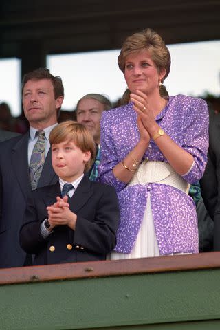 <p>Rebecca Naden/PA Images via Getty</p> Princess Diana and Prince William attend Wimbledon in 1991.