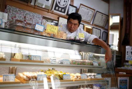 Confectionery shop owner Shigeyuki Kaneta, 46, works at his shop in Nanmoku Village, northwest of Tokyo, Japan October 12, 2017. Picture taken October 12, 2017. REUTERS/Issei Kato