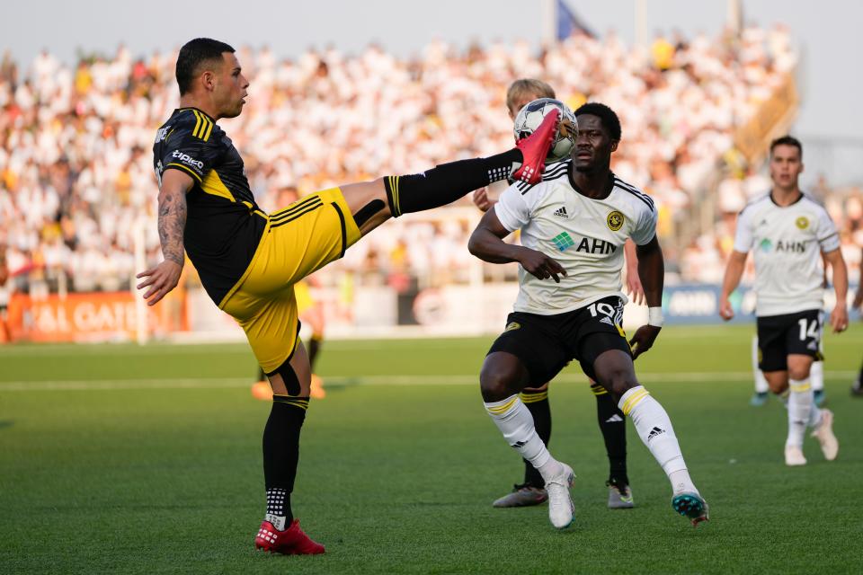 Crew forward Christian Ramirez kicks the ball over Pittsburgh Riverhounds midfielder DZ Harmon on Wednesday.