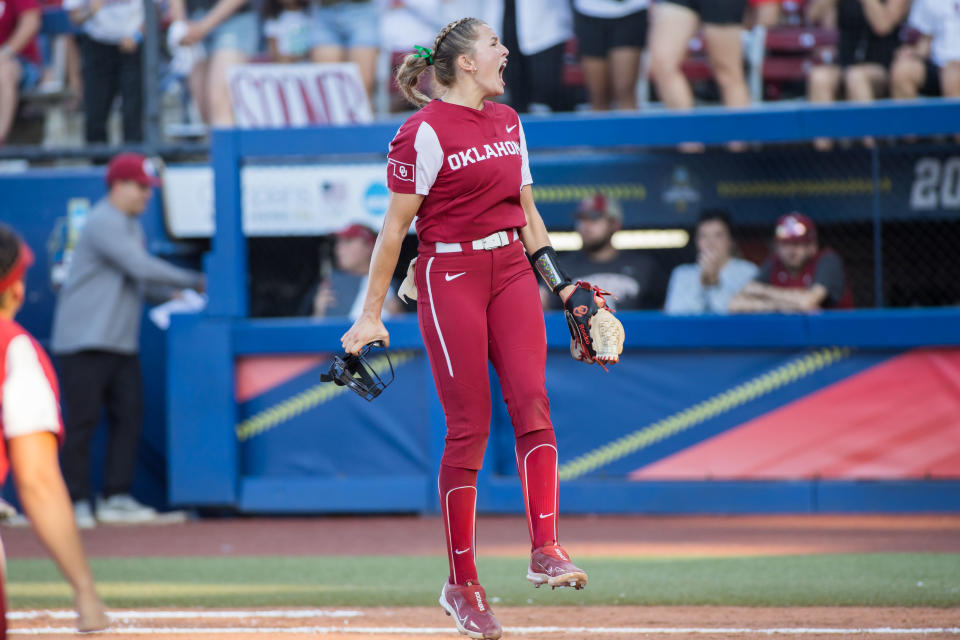 June 8, 2023; Oklahoma City; Oklahoma Sooners starting pitcher Alex Storako (8) yells after the final out of the third inning against against the Florida State Seminoles during game two of the Women’s College World Series finals at OGE Energy Field at the USA Softball Hall of Fame Complex. Oklahoma won the game 3-1 and the national championship. Brett Rojo-USA TODAY Sports