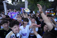 Real Madrid supporters celebrate in Cibeles Square in Madrid after their team clinched the La Liga title, Saturday, May 4, 2024. Real, who had won earlier in the day, clinched the title after Barcelona failed to beat Girona. (AP Photo/Manu Fernandez)