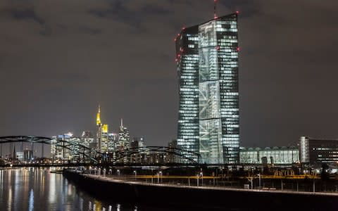 The European Central Bank (ECB) headquarters, right, are illuminated by light as the building stands on the skyline by the River Main in Frankfurt, Germany, on Friday, March 6, 2015. The final countdown is under way for the European Central Bank's program of government-bond purchases, which already fueled a debt-market rally that sent yields across the euro region to record lows. Photographer: Martin Leissl/Bloomberg Image title: GERMANY ECB BUILDING Credit: Martin Leissl Filename: TELEMMGLPICT000056783110.jpeg - Credit: Martin Leissl/Bloomberg