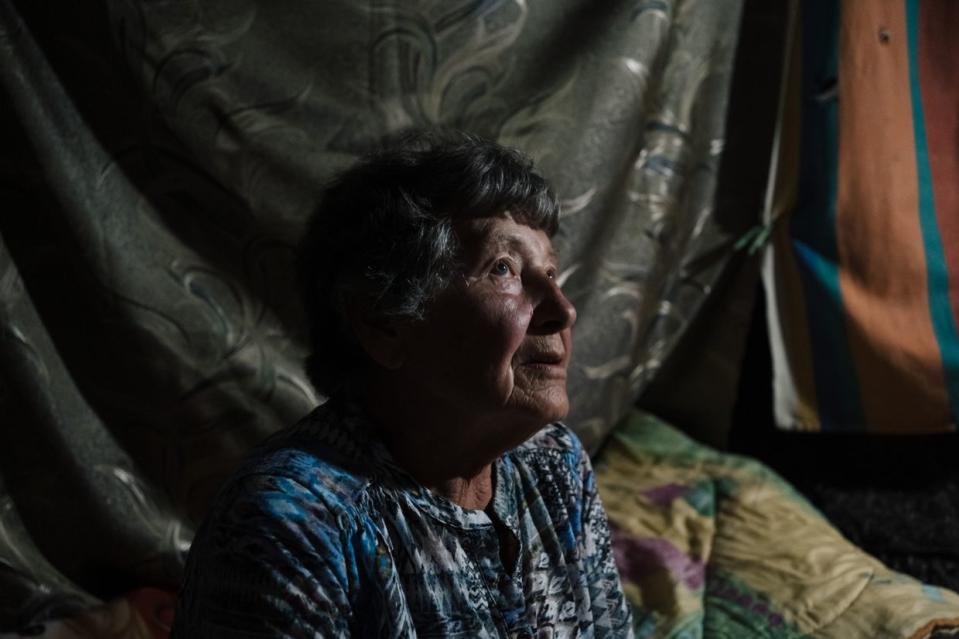 Halyna, 84, photographed in the basement of her residential building in Velyka Novosilka, Donetsk Oblast on Sept. 11, 2023. (Anastasia Vlasova / The Kyiv Independent)
