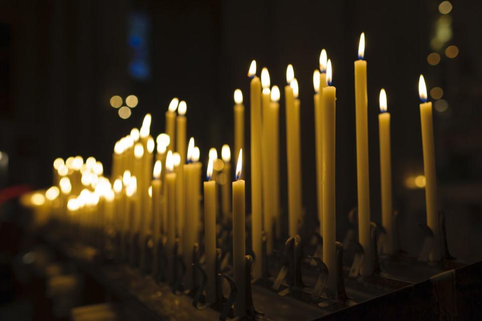 lit candles in church interior at christmas