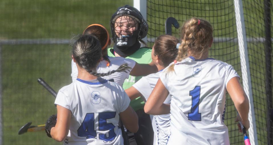 Shore Regional goalie Teagan Harmon is mobbed by team mates after blocking a penalty shot. sShore Regional  defeats Point Pleasant Borough 2-1 in Shore Conference Field Hockey final in Holmdel, NJ on October 30, 2022.