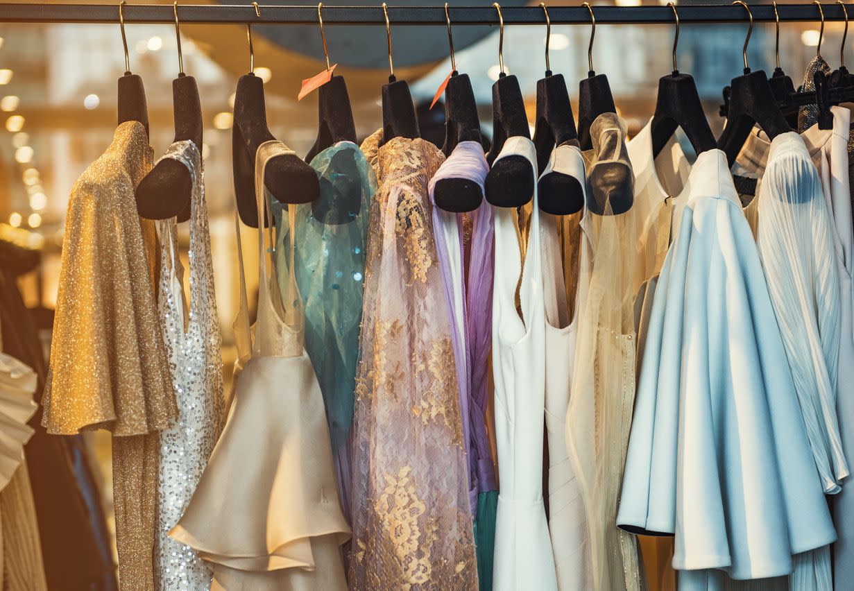 An image of a nice set of dresses that have been hung up.