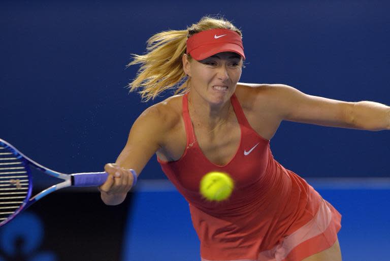 Russia's Maria Sharapova plays a shot during her women's singles final match against Serena Williams of the US on day thirteen of the 2015 Australian Open tennis tournament in Melbourne on January 31, 2015