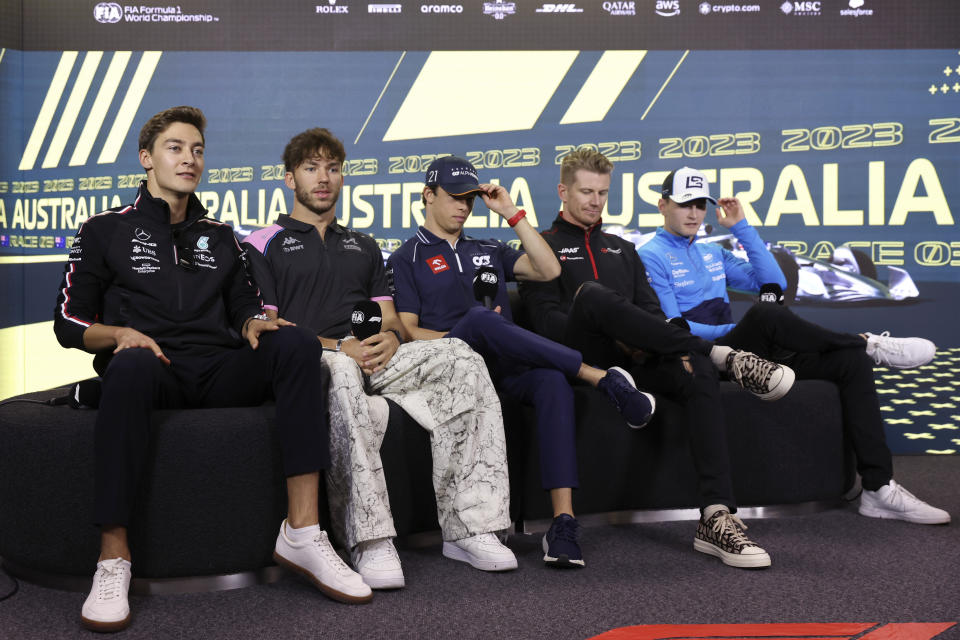 Mercedes driver George Russell of Britain, left, Alpine driver Pierre Gasly of France, second left, AlphaTauri driver Nick de Vries of the Netherlands, Haas driver Nico Hulkenberg of Germany, second right, and Williams driver Logan Sargeant of the US, right, attend a press conference ahead of the Australian Formula One Grand Prix at Albert Park in Melbourne, Thursday, March 30, 2023. (AP Photo/Asanka Brendon Ratnayake)