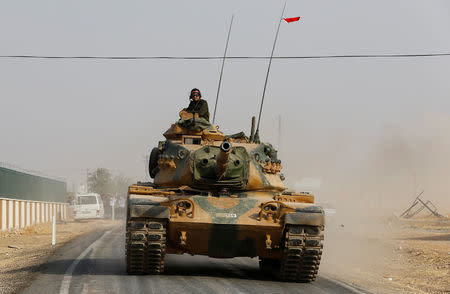 A Turkish army tank drives towards to the border in Karkamis on the Turkish-Syrian border in the southeastern Gaziantep province, Turkey, August 25, 2016. REUTERS/Umit Bektas