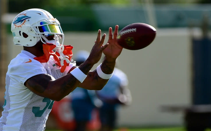 Aug 4, 2016; Miami Gardens, FL, USA; Miami Dolphins running back Arian Foster (34) hauls in a catch during practice drills at Baptist Health Training Facility. Mandatory Credit: Steve Mitchell-USA TODAY Sports