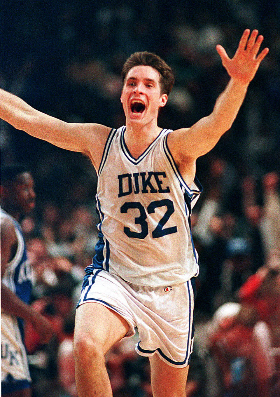 FILE - In this March 28, 1992, file photo, Duke's Christian Laettner runs down the court after making the last-second winning shot to defeat Kentucky in the East Regional final NCAA college basketball game in Philadelphia. The All-American ended one of the greatest college basketball games ever with a turnaround jumper at the overtime buzzer, giving defending national champion Duke a 104-103 victory over Kentucky and a fifth straight trip to the Final Four. (AP Photo/Amy Sancetta, File)