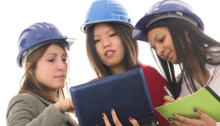 young girl engineer at work with laptop