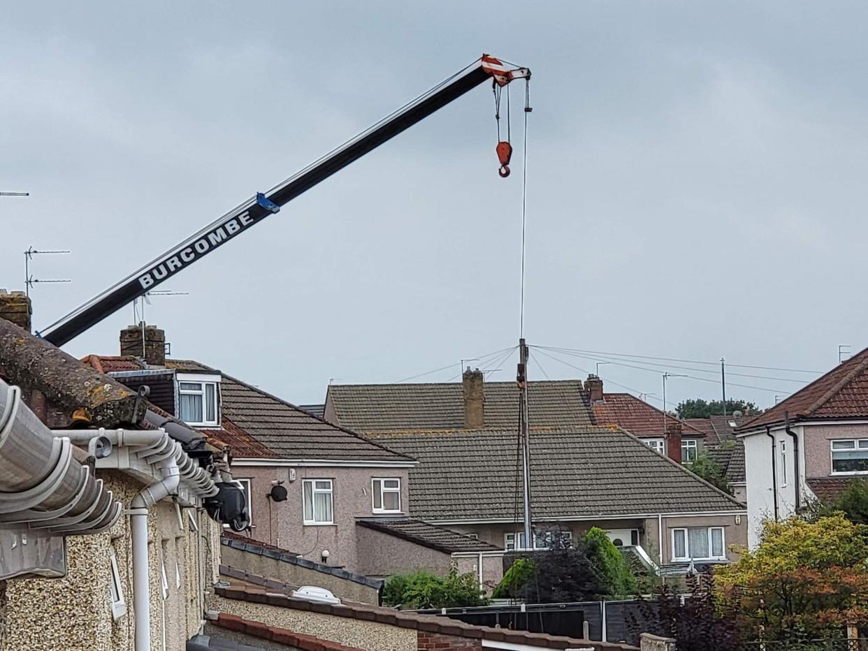 A man in his 70s has died after a heavy load fell from a crane in the Mangotsfield area of Bristol. (BPM Media)