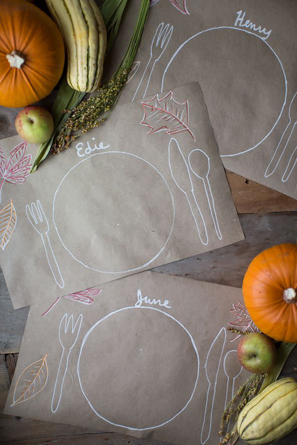 <p>Personalize kids' spots at the table with fall-colored markers and chalkboard markers.</p><p><strong>Get the tutorial at <a rel="nofollow noopener" href="http://sayyes.com/2015/10/the-thanksgiving-kids-table.html" target="_blank" data-ylk="slk:Say Yes;elm:context_link;itc:0;sec:content-canvas" class="link ">Say Yes</a>.</strong></p>
