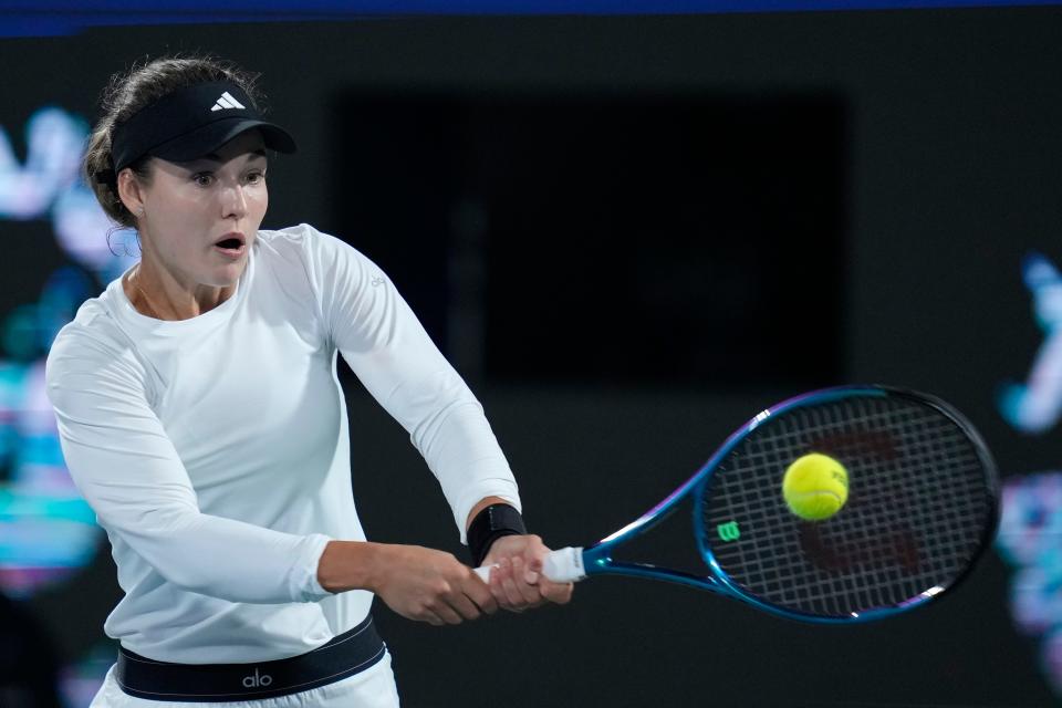 Anna Kalinskaya returns the ball to Jasmine Paolini of Italy during the final match of the Dubai Duty Free Tennis Championships in Dubai, United Arab Emirates, Saturday, Feb. 24, 2024. (AP Photo/Kamran Jebreili)