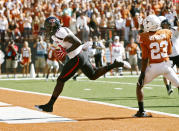 AUSTIN, TX - NOVEMBER 5: Wide receiver Eric Ward #18 of the Texas Tech Red Raiders hauls in a third quarter touchdown against cornerback Carrington Byndom #23 of the Texas Longhorns on November 5, 2011 at Darrell K. Royal-Texas Memorial Stadium in Austin, Texas. Texas beat Texas Tech 52-20. (Photo by Erich Schlegel/Getty Images)