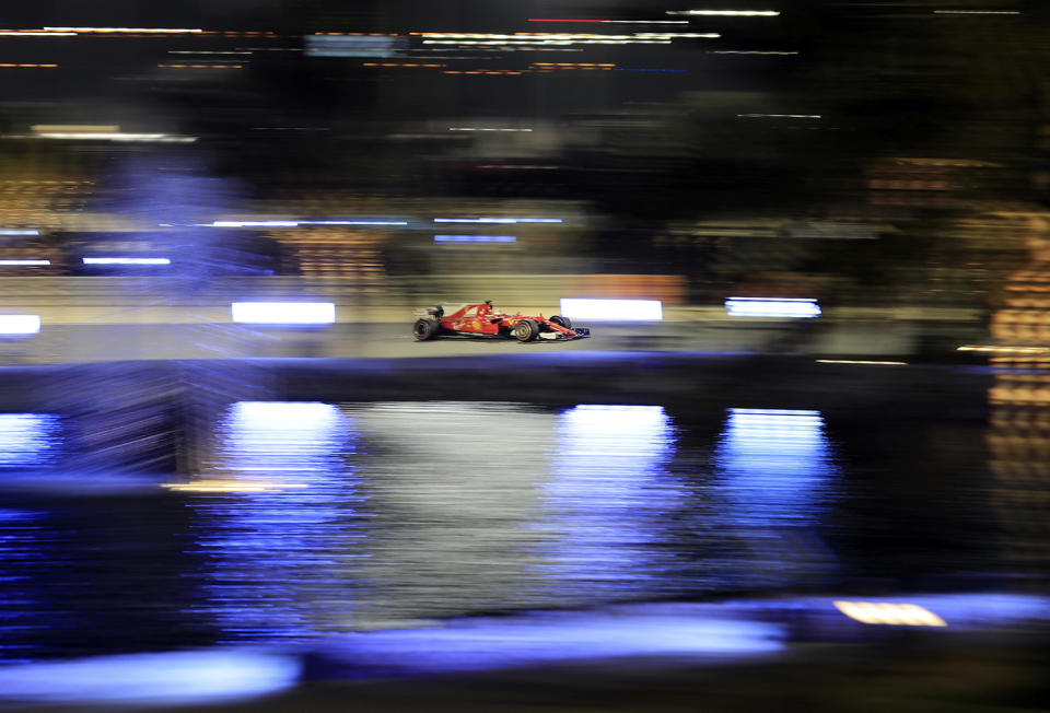 Sebastian Vettel racing in Bahrain Formula One Grand Prix