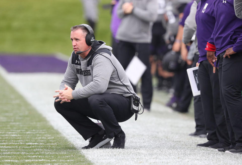 Northwestern coach Pat Fitzgerald crouches on the sidelines in the first quarter against Wisconsin at Ryan Field on October 27, 2018 in Evanston, Illinois.  (John J. Kim/Chicago Tribune/Tribune News Service via Getty Images)