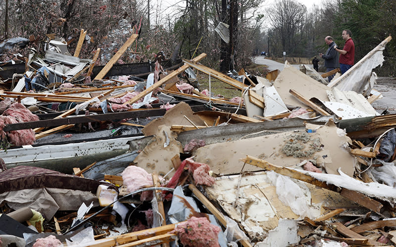 National Weather Service members survey damage in Flatwood, Ala.