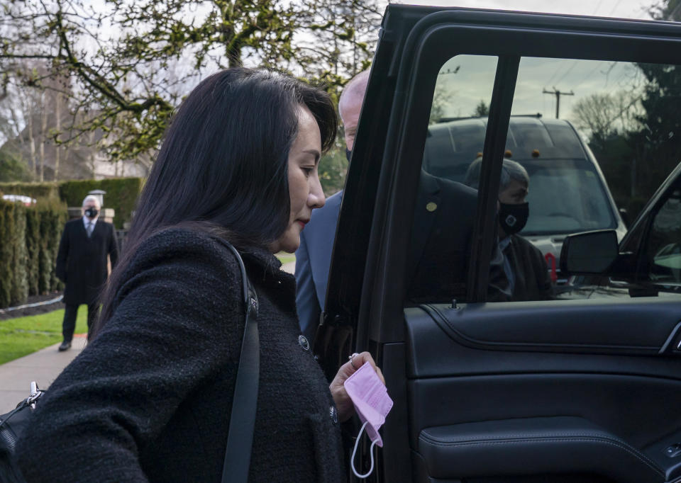 Chief Financial Officer of Huawei, Meng Wanzhou leaves her home in Vancouver, British Columbia, to go to British Columbia Supreme Court, Thursday, March 25, 2021. (Jonathan Hayward/The Canadian Press via AP)