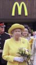 <p>Princess Diana isn't the only royal who likes McDonald's! Here, Queen Elizabeth II is seen outside a drive-through location at the Cheshire Oaks Designer Outlet. Sure, maybe she was just making an appearance that was located n<em>e</em>ar the restaurant, but it's undeniable that her outfit matches the golden arches.</p>