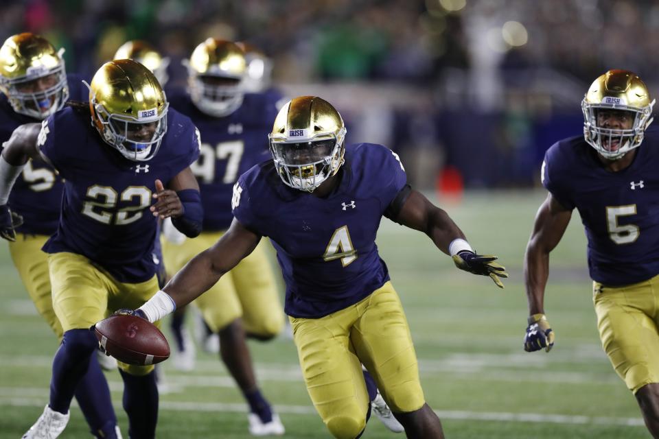 Notre Dame linebacker Te'von Coney (4) reacts after intercepting a pass intended for Stanford tight end Kaden Smith during the second half of an NCAA college football game, Saturday, Sept. 29, 2018, in South Bend, Ind. (AP Photo/Carlos Osorio)