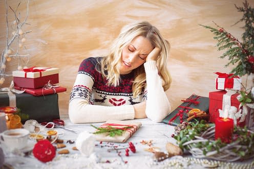 <span class="caption">Christmas isn't a joyful time of year for everyone.</span> <span class="attribution"><a class="link " href="https://www.shutterstock.com/image-photo/woman-tired-gift-wrapping-344854967" rel="nofollow noopener" target="_blank" data-ylk="slk:Kaspars Grinvalds/ Shutterstock;elm:context_link;itc:0;sec:content-canvas">Kaspars Grinvalds/ Shutterstock</a></span>