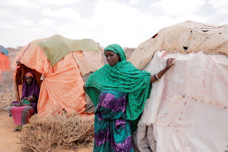 A nine-month pregnant displaced woman, Amina Ali, 23, stands beside her shelter at a makeshift settlement in Bardihahle near Burao, northwestern Togdheer region of Somaliland March 26, 2017. REUTERS/Zohra Bensemra