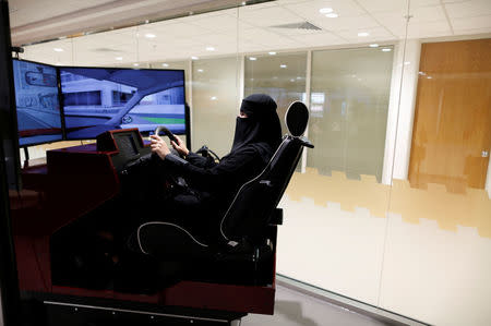 Trainee Amira Abdulgader practices with a screen in front of her during a driving lesson at Saudi Aramco Driving Center in Dhahran, Saudi Arabia, June 6, 2018. REUTERS/Ahmed Jadallah