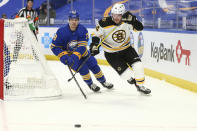 Buffalo Sabres defenseman Jacob Bryson (78) and Boston Bruins forward Chris Wagner (14) race for the puck during the first period of an NHL hockey game, Tuesday, April 20, 2021, in Buffalo, N.Y. (AP Photo/Jeffrey T. Barnes)