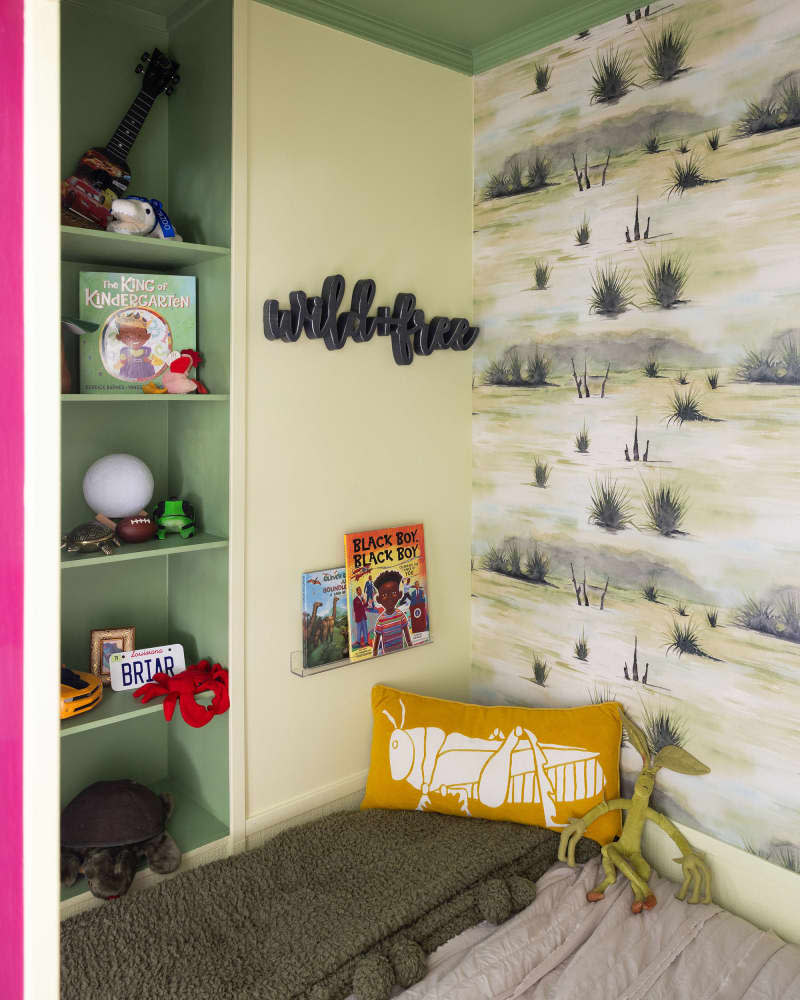 green bed nook with shelves in kids room after makeover