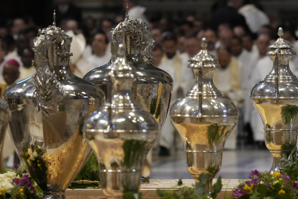 A view of jars contained chrism oil during a Chrism Mass where the chrism, the oil of the catechumens and the oil of the sick are consecrated, and all the priests renew the promises made on the day of their ordination, inside St. Peter's Basilica, at the Vatican, Thursday, April 6, 2023. (AP Photo/Andrew Medichini)