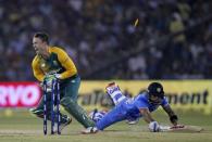 India's Virat Kohli dives to make the crease as he is run out by South Africa's AB de Villiers during their second Twenty20 cricket match in Cuttack, India, October 5, 2015. REUTERS/Danish Siddiqui