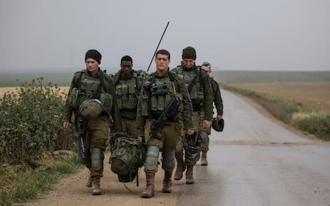 Israeli soldiers deploy on the Israel and Gaza border - Credit: &nbsp;Tsafrir Abayov/&nbsp;AP