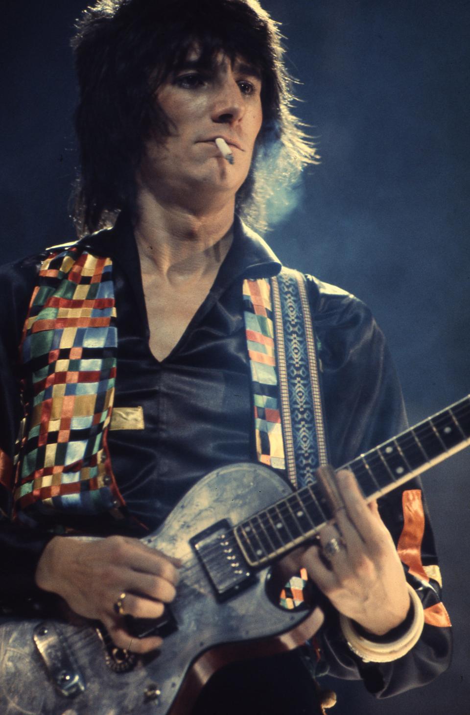 British guitarist Ronnie Wood of the Faces performing on stage in 1972. (Photo by Michael Putland/Getty Images)