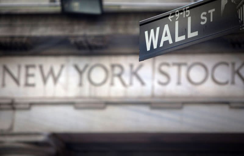 FILE PHOTO: FILE PHOTO: A Wall Street sign outside the New York Stock Exchange