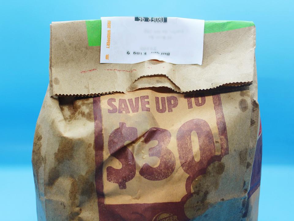 A sealed burger king brown delivery bag