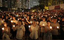 Tens of thousands of people attend a candlelight vigil at Victoria Park in Hong Kong on June 4, 2016, to commemorate victims of the 1989 military crackdown in Beijing. The group, Hong Kong Alliance in Support of Patriotic Democratic Movements of China, that had organized annual vigils in remembrance of victims of the Chinese military’s crushing of the 1989 Tiananmen Square pro-democracy protests voted to disband Saturday, Sept. 25, 2021 amid an ongoing crackdown on independent political activism in the semi-autonomous Chinese city. (AP Photo/Kin Cheung)