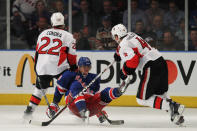 NEW YORK, NY - APRIL 26: Marian Gaborik #10 of the New York Rangers falls to the ice against the defense of Erik Condra #22 and Chris Phillips #4 of the Ottawa Senators in the third period of Game Seven of the Eastern Conference Quarterfinals during the 2012 NHL Stanley Cup Playoffs at Madison Square Garden on April 26, 2012 in New York City. (Photo by Bruce Bennett/Getty Images)