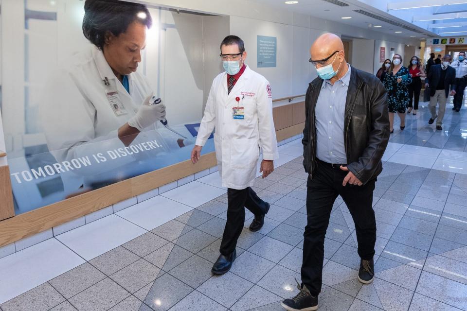 Moncef Slaoui, right, tours Temple University Hospital with Tony Reed, chief medical officer, on Nov. 20. Slaoui is co-director of Operation Warp Speed, the Trump administration's effort to rapidly develop, manufacture and distribute COVID-19 vaccines and treatments.