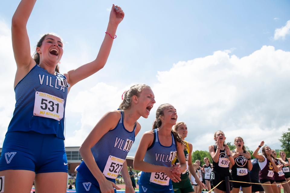 Villa Maria runners, from left, Lauren Raimy, Allison Bender and Sarah Teed react as Sarah Clark crosses the finish line to give the Victors a fourth-place finish (9:49.53) in the Class 2A 3,200-meter relay at the PIAA track and field championships at Shippensburg University on Saturday.