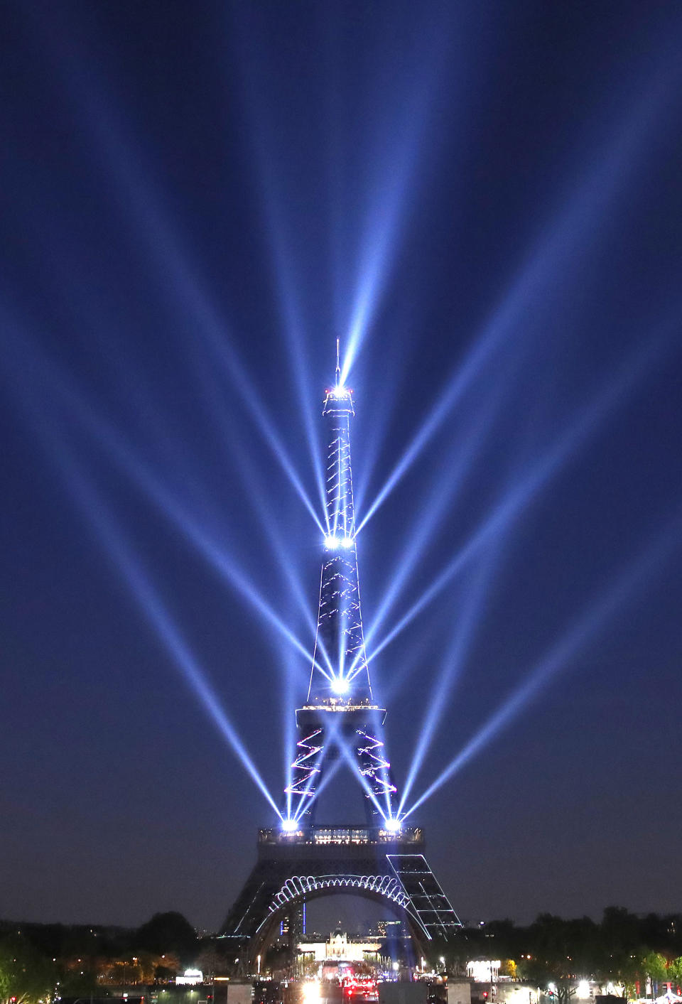 A light show illuminates the Eiffel Tower for its 130 year anniversary, in Paris, Wednesday, May 15, 2019. Paris is wishing the Eiffel Tower a happy birthday with an elaborate laser show retracing the monument's 130-year history. (AP Photo/Christophe Ena)