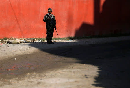 Nepalese army personnel stands guard near the improvised explosive device (unseen), a day ahead of the parliamentary and provincial elections in Kathmandu, Nepal December 6, 2017. REUTERS/Navesh Chitrakar