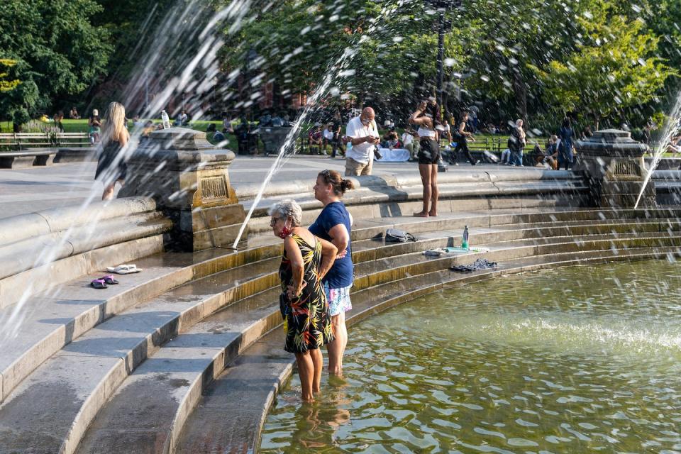 Standing in a fountain can help cool a person off to a point, but being exposed to the sun when the heat index is 100 F, as this day in New York City was in 2021, can be dangerous, especially for older adults. <a href="https://www.gettyimages.com/detail/news-photo/two-women-stand-in-the-fountain-in-washington-square-park-news-photo/1333649056?adppopup=true" rel="nofollow noopener" target="_blank" data-ylk="slk:Alexi Rosenfeld/Getty Images;elm:context_link;itc:0;sec:content-canvas" class="link ">Alexi Rosenfeld/Getty Images</a>