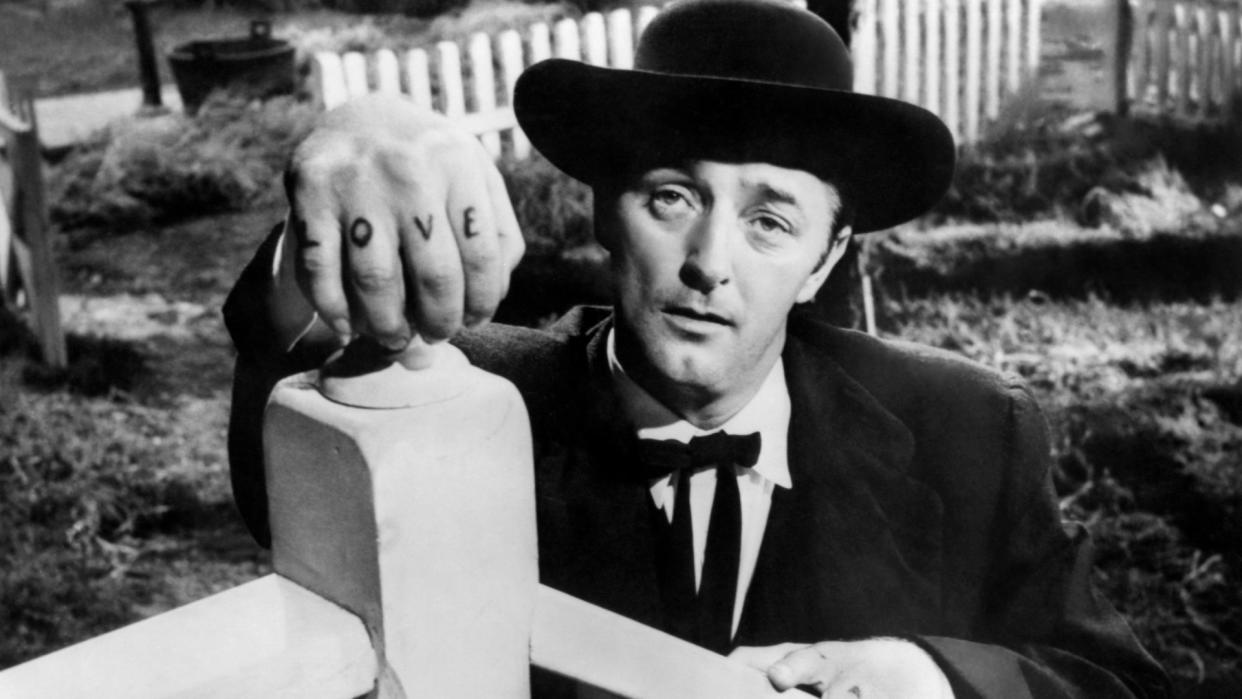  Robert Mitchum as Harry Powell in The Night of the Hunter. 