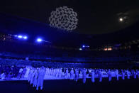 FILE - Drones perform a globe above the roof of the stadium during the opening ceremony in the Olympic Stadium at the 2020 Summer Olympics, Friday, July 23, 2021, in Tokyo, Japan. Creative director Marco Balich, reveals to The Associated Press that he has been working for a year on a 30-minute show that will run ahead of the Soccer World Cup 2022 opening game between Qatar and Ecuador. He says local organizers "wanted to create a real show, which FIFA is not accustomed to.” (AP Photo/Natacha Pisarenko, File)