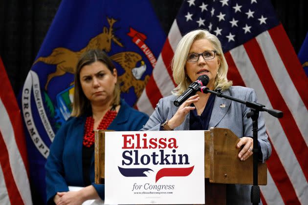 At a Nov. 1 campaign event in East Lansing, Michigan, Democratic Rep. Elissa Slotkin of Michigan (left) looks on as GOP Rep. Liz Cheney of Wyoming makes a plea for supporting candidates like Slotkin who are committed to democracy and recognizing election results. (Photo: JEFF KOWALSKY via Getty Images)