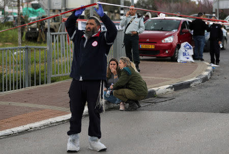 An Israeli soldier reacts at the scene of Palestinian shooting attack near the Jewish settlement of Ariel, in the occupied West Bank March 17, 2019. REUTERS/Ammar Awad